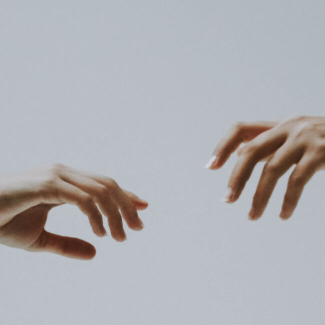 hands reaching out to each other