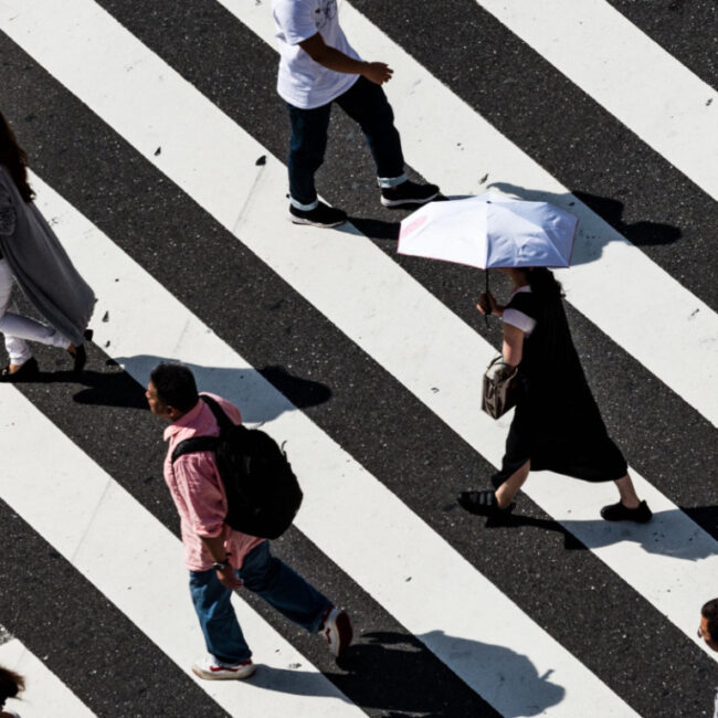 regulars people walking at crosswalk