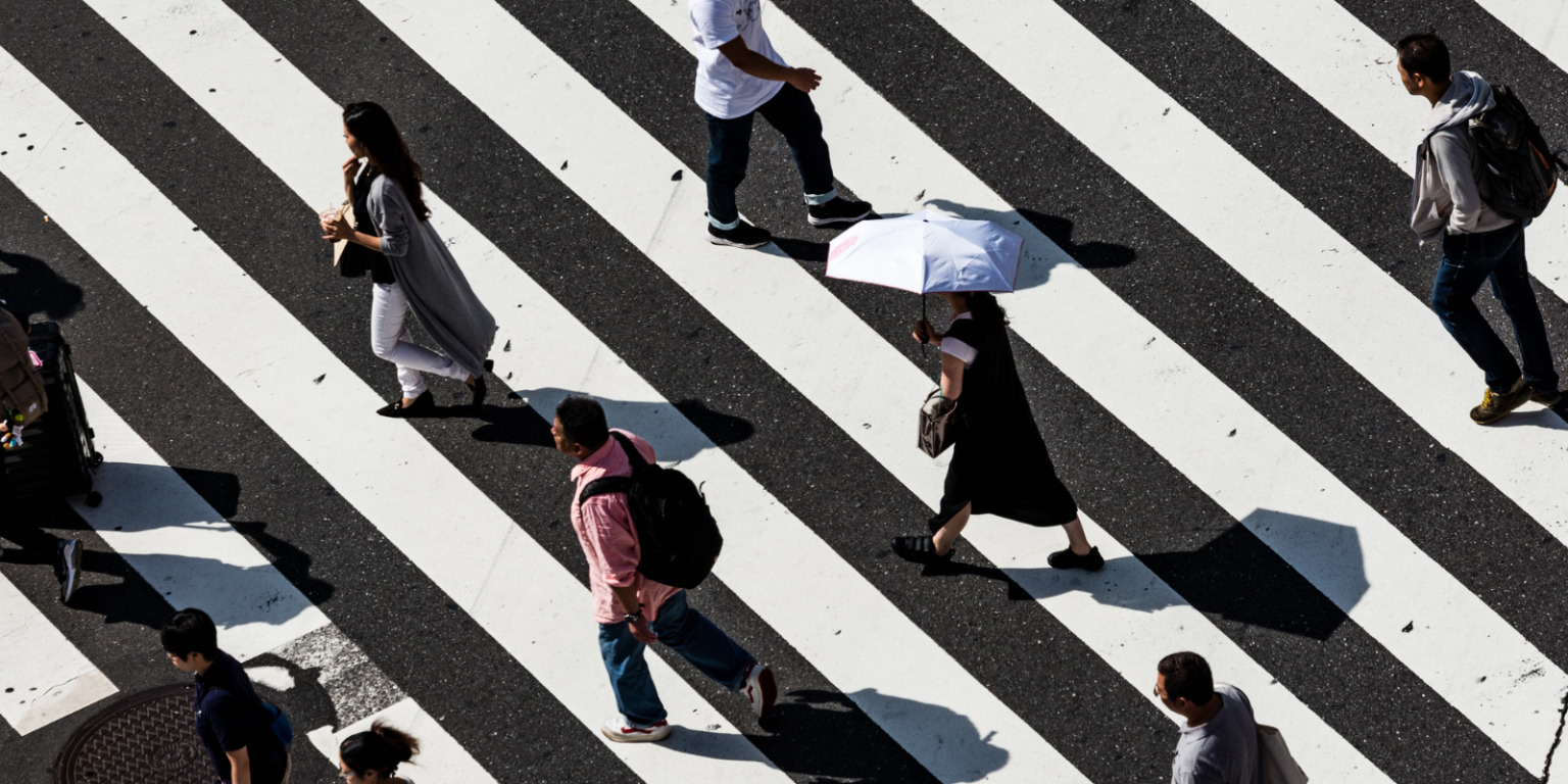 regulars people walking at crosswalk