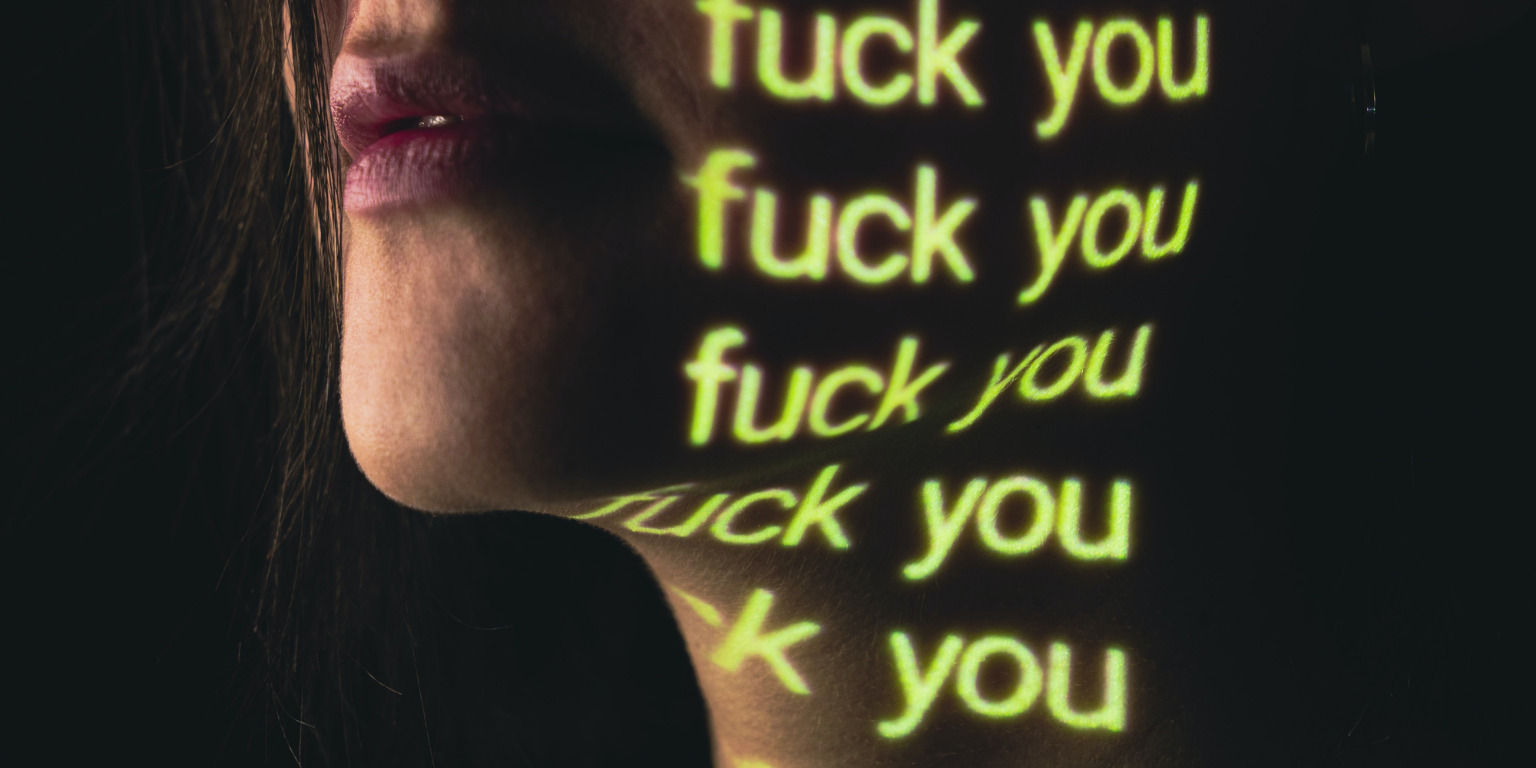 cheek with the words 'fuck you' in light over and over again on them