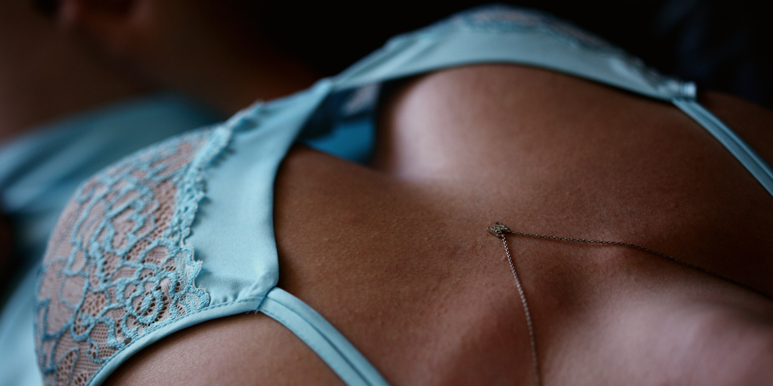 black woman in blue bralette lingerie