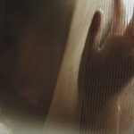 woman behind sheets