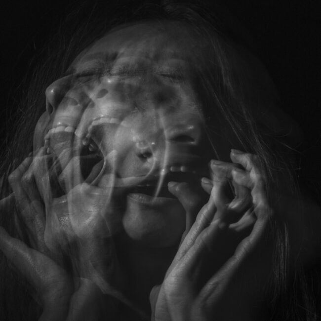 woman screaming in black and white photo