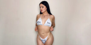 Trans pornstar Aviva wearing white bikini