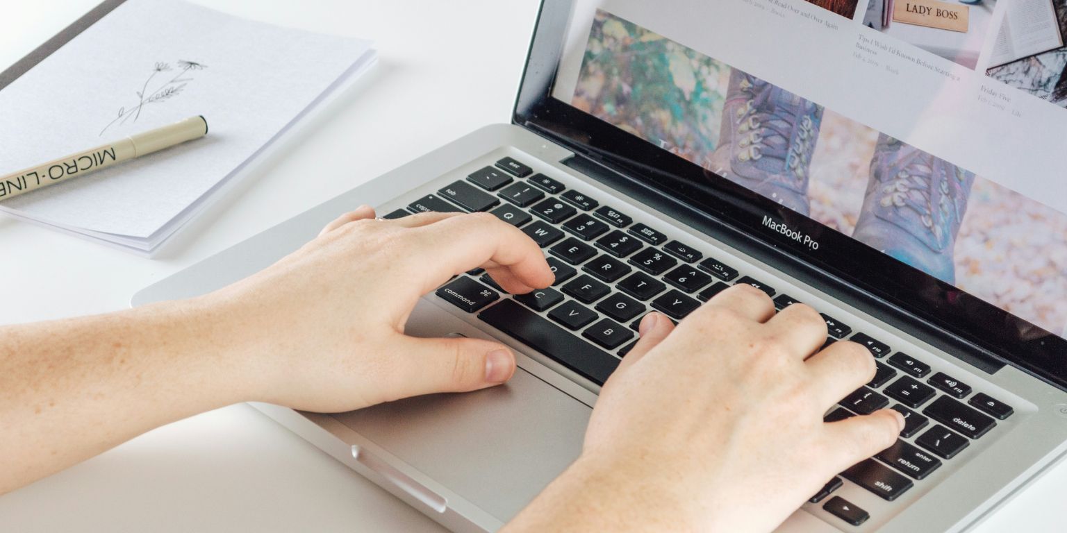 Man typing on Macbook