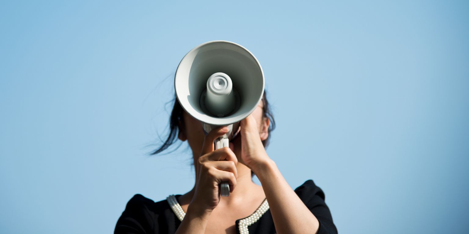 Woman speaking through a megaphone