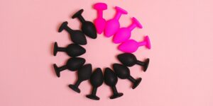 pink and black buttplugs forming a circle