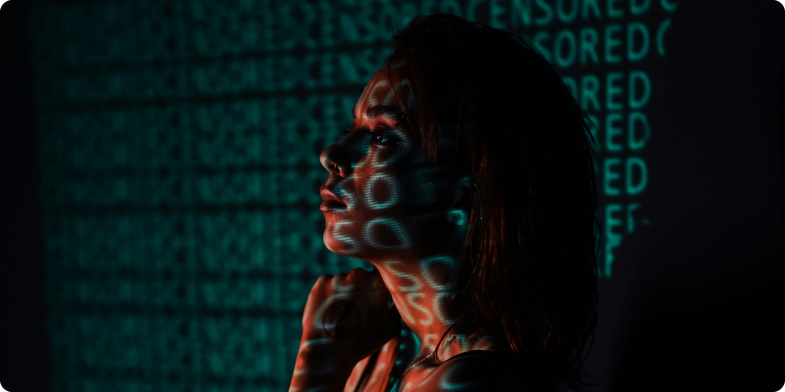 woman standing in front of a proyector