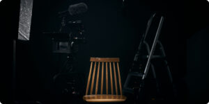 Studio with professional camera, microfono, and ladder with different camera lenses