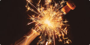 champagne bottle popping with fireworks